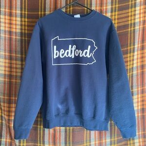 Navy blue crewneck sweater with Bedford design